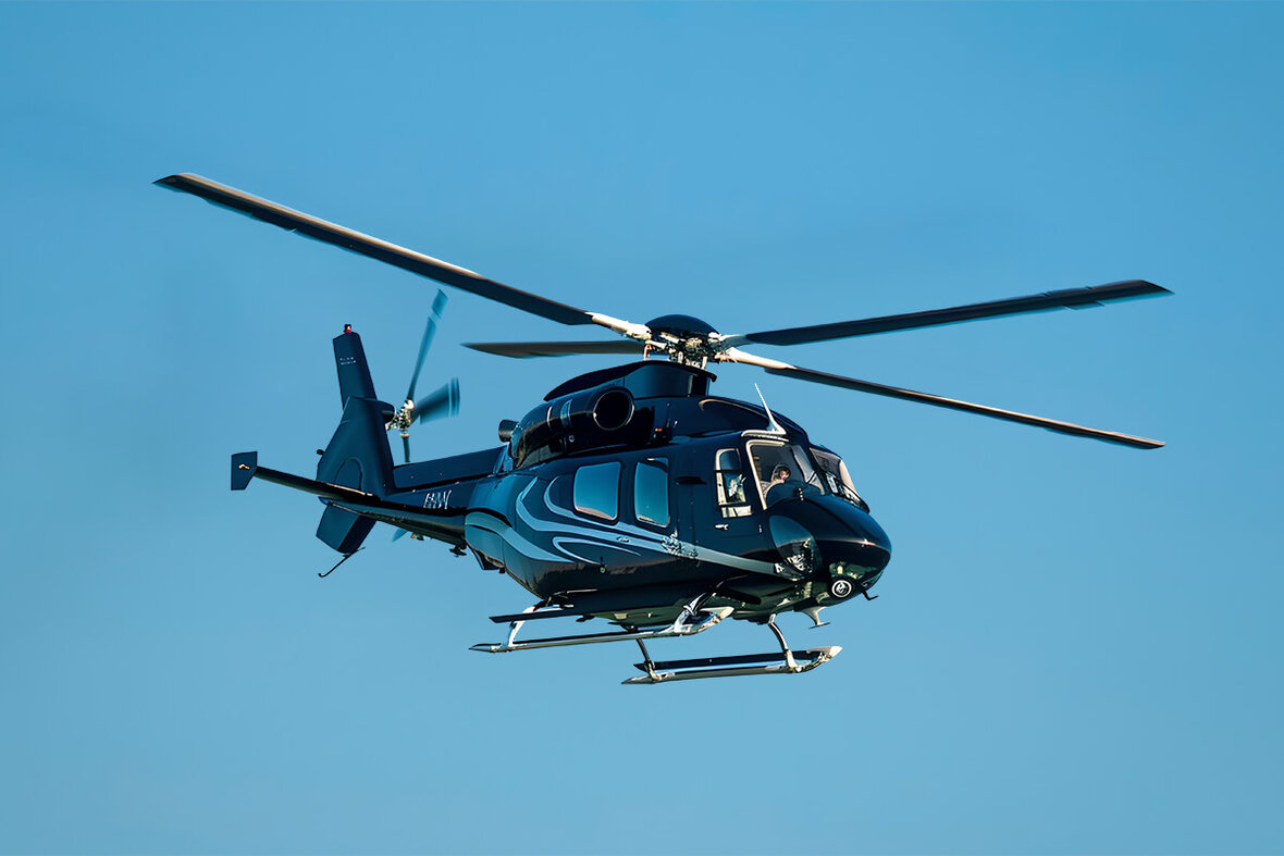 A helicopter flies in the sky.