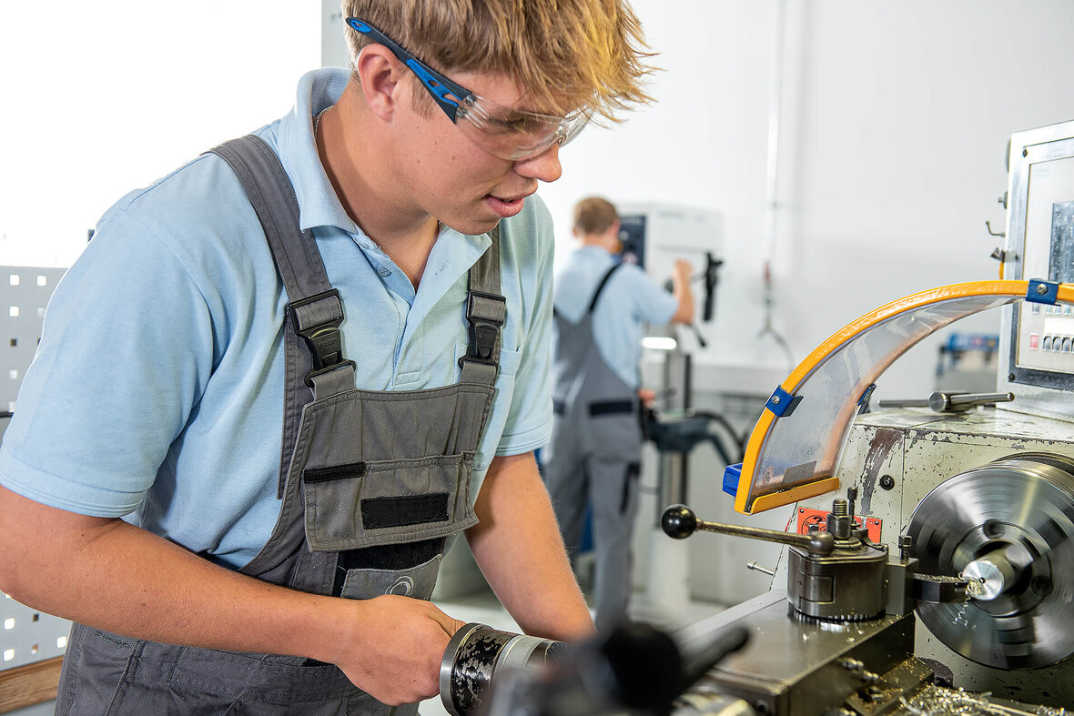 A SCHLEIFRING trainee works in a workshop.