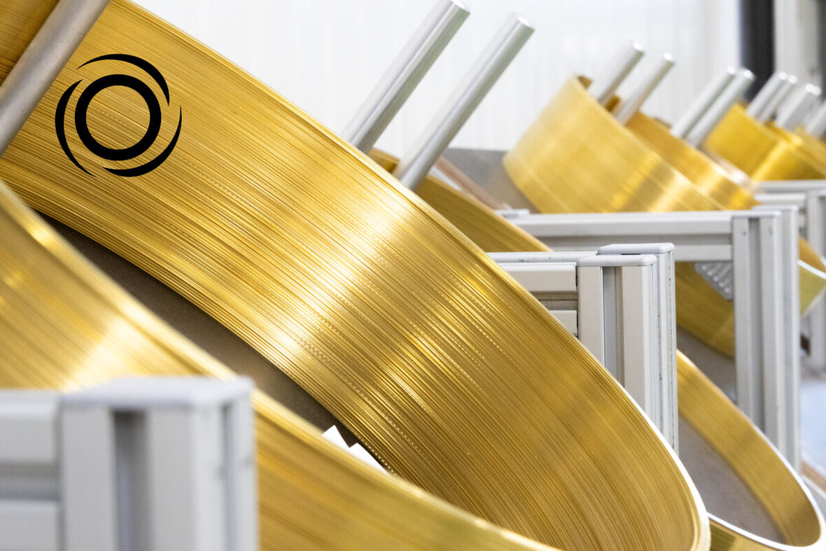 Gold-colored metal bands in an industrial manufacturing facility
