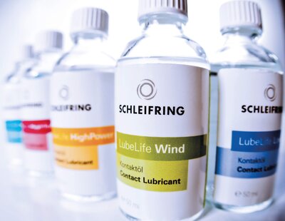 Product photo of several bottles of contact oil.